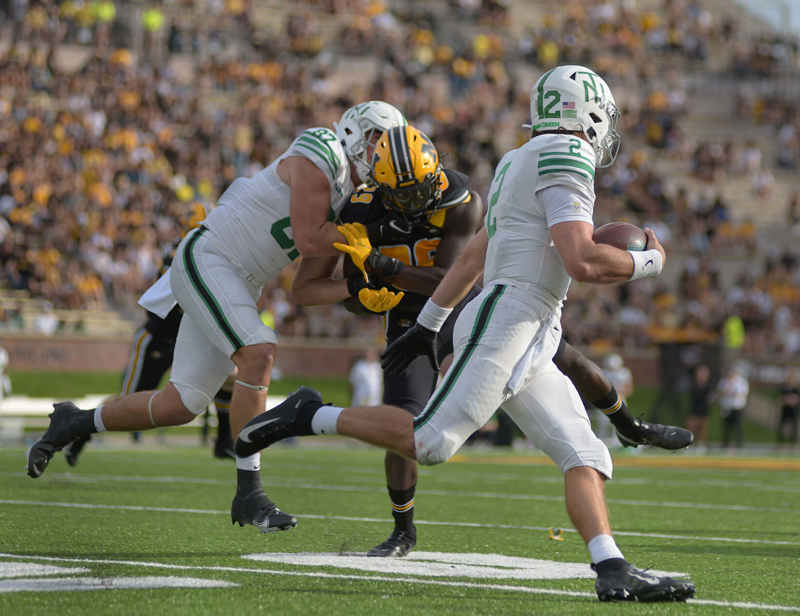 Austin Aune runs with the ball